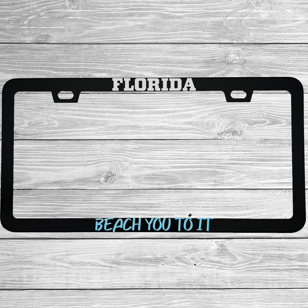 Close-up of "Florida Beach You To It" license plate frame showing fade-proof print quality