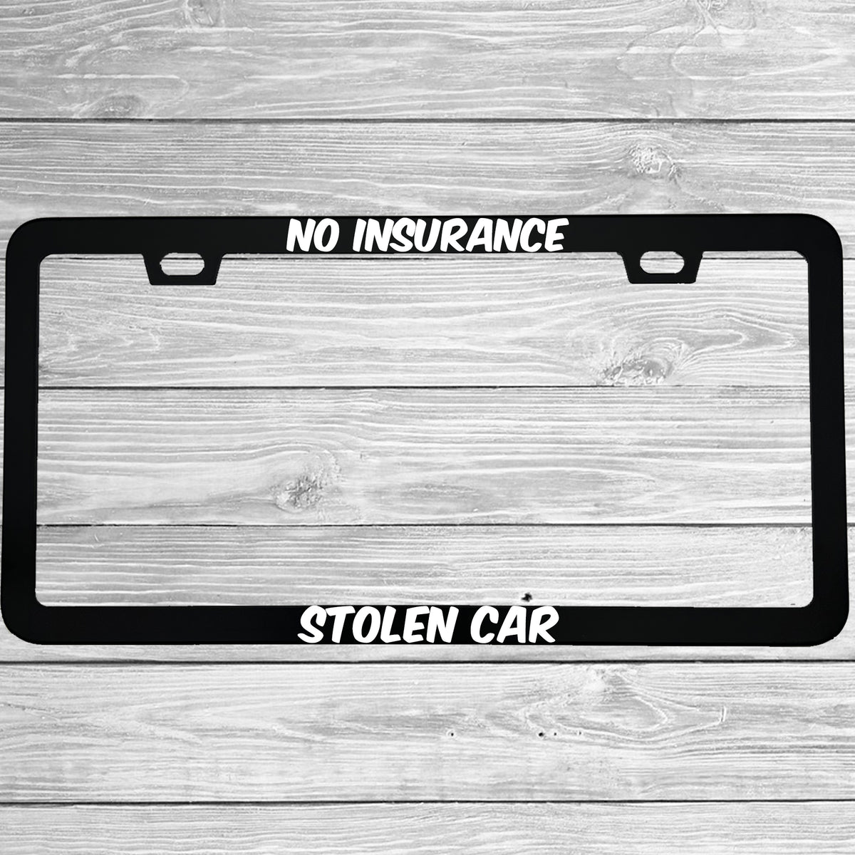 Close-up of "No Insurance Stolen Car" license plate frame showing fade-proof print quality