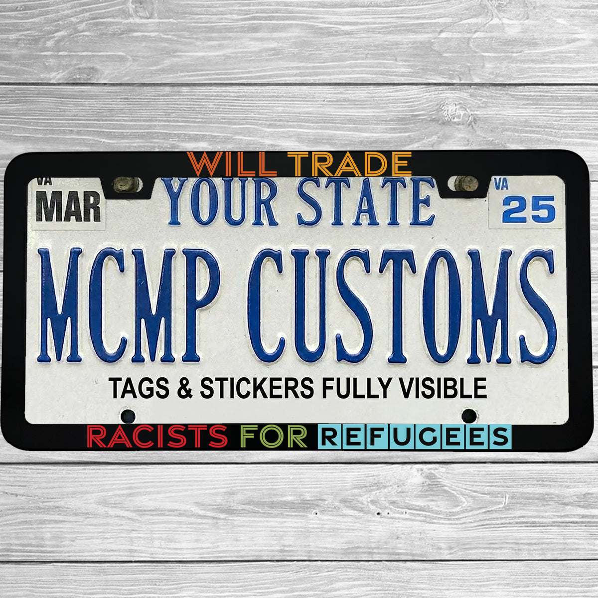 "Will Trade Racists For Refugees" license plate frame shown on vehicle — lifestyle photo