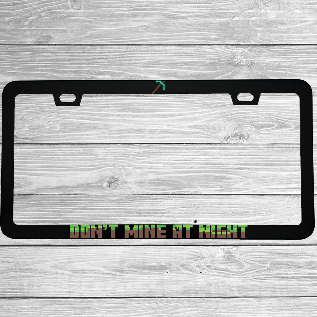 Close-up of "Don't Mine At Night Minecraft" license plate frame showing fade-proof print quality