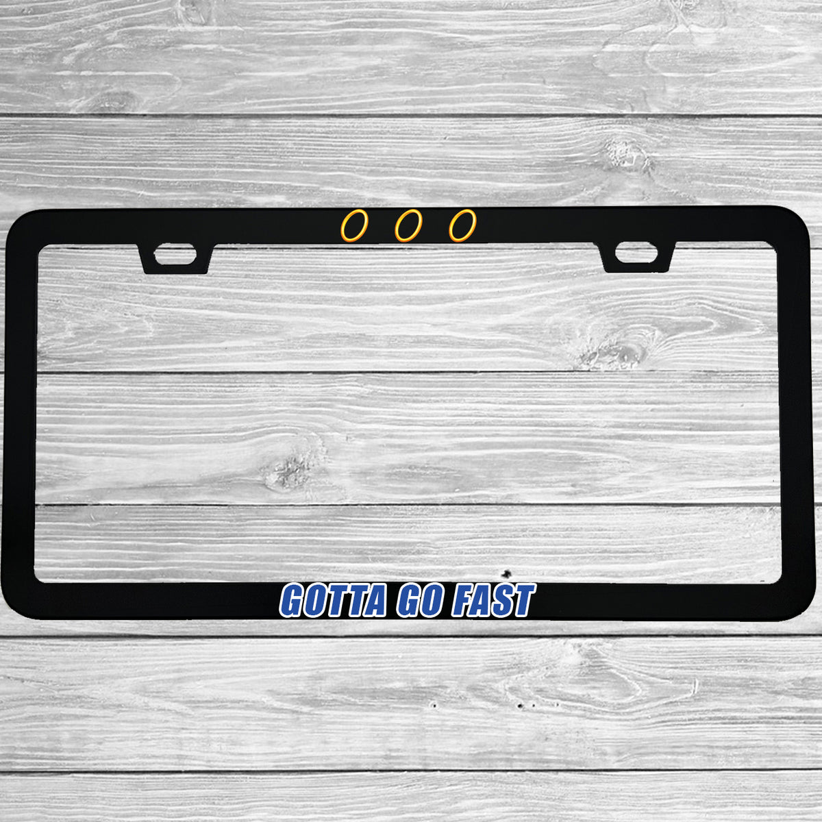 Close-up of "Gotta Go Fast" license plate frame showing fade-proof print quality