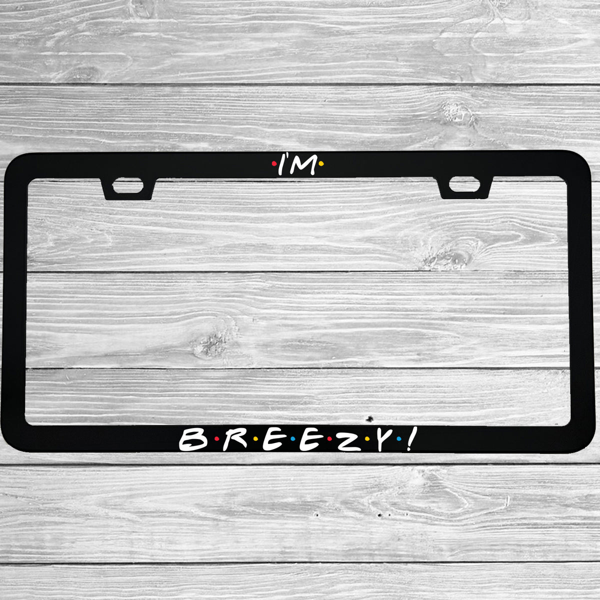Close-up of "I'm Breezy" license plate frame showing fade-proof print quality