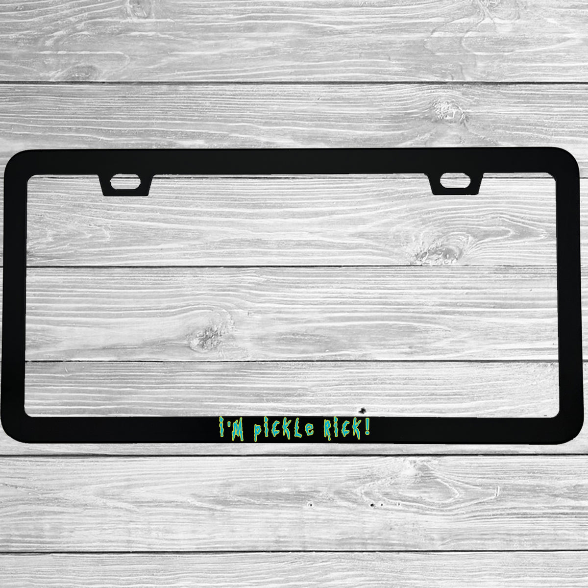 Close-up of "I'm Pickle Rick!" license plate frame showing fade-proof print quality