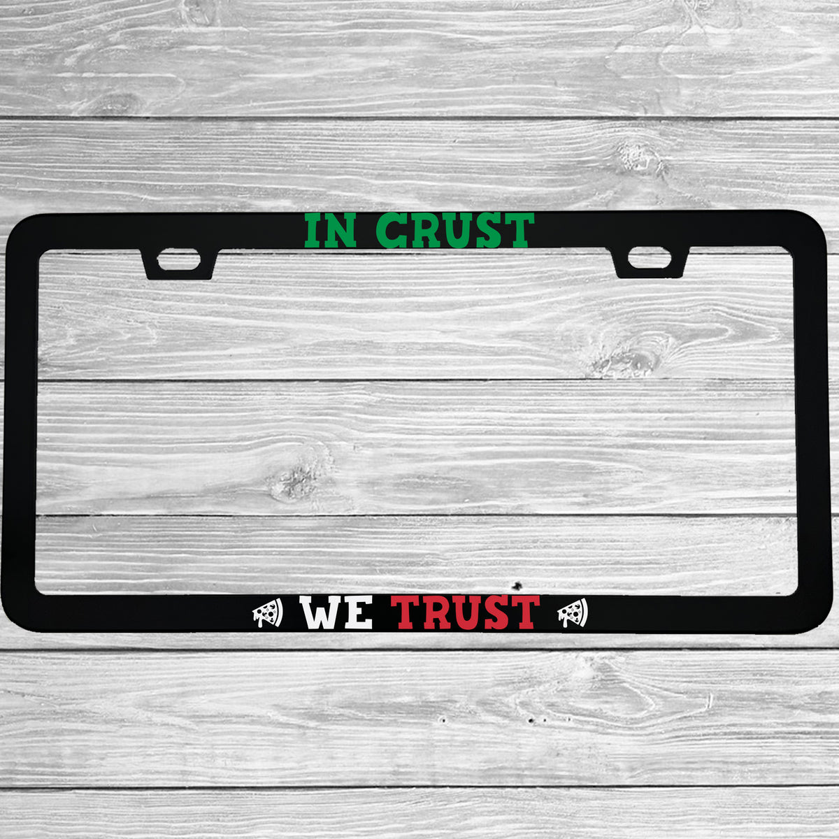 Close-up of "In Crust We Trust" license plate frame showing fade-proof print quality