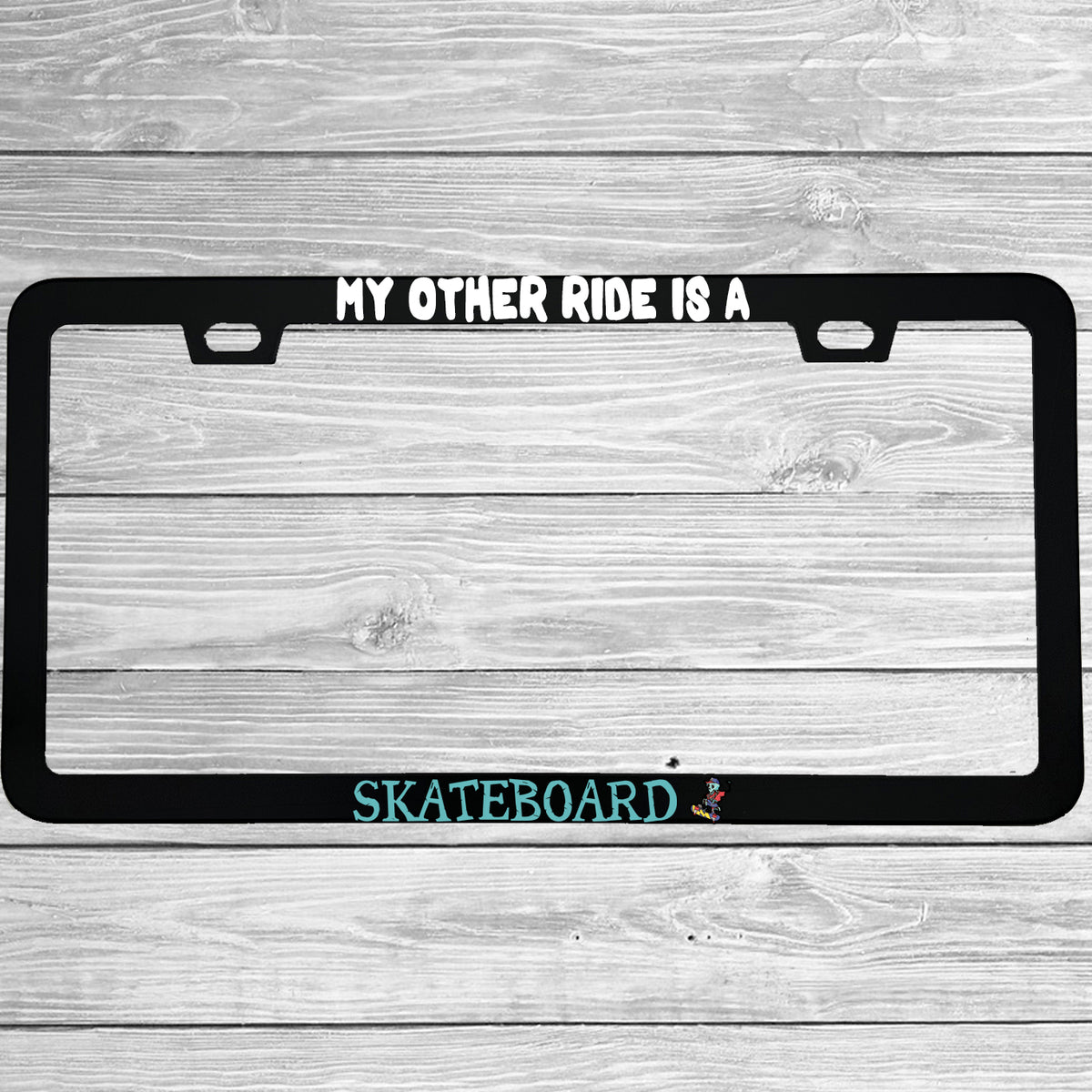 Close-up of "My Other Ride Is A Skateboard" license plate frame showing fade-proof print quality