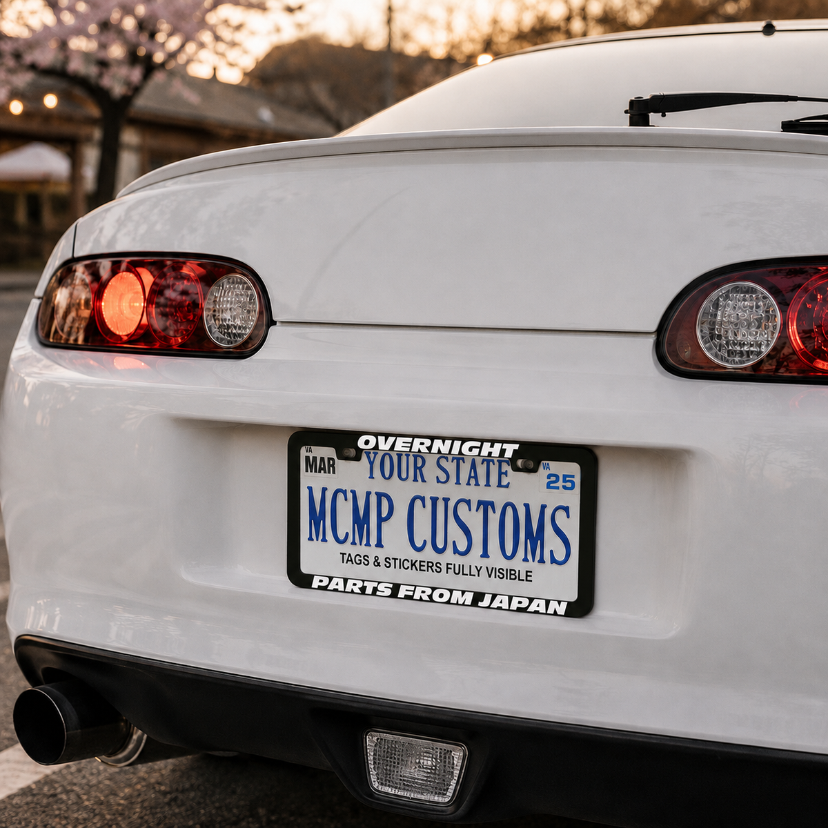 "Overnight Parts From Japan Fast and Furious" license plate frame shown on vehicle β lifestyle photo
