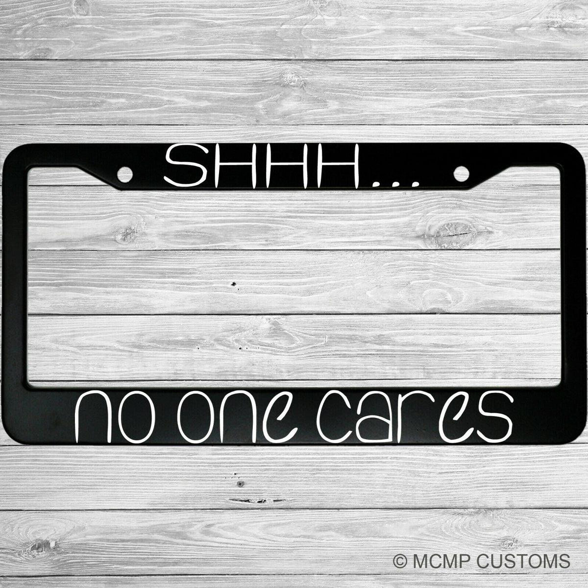 "Shhh No One Cares" license plate frame shown on vehicle β lifestyle photo