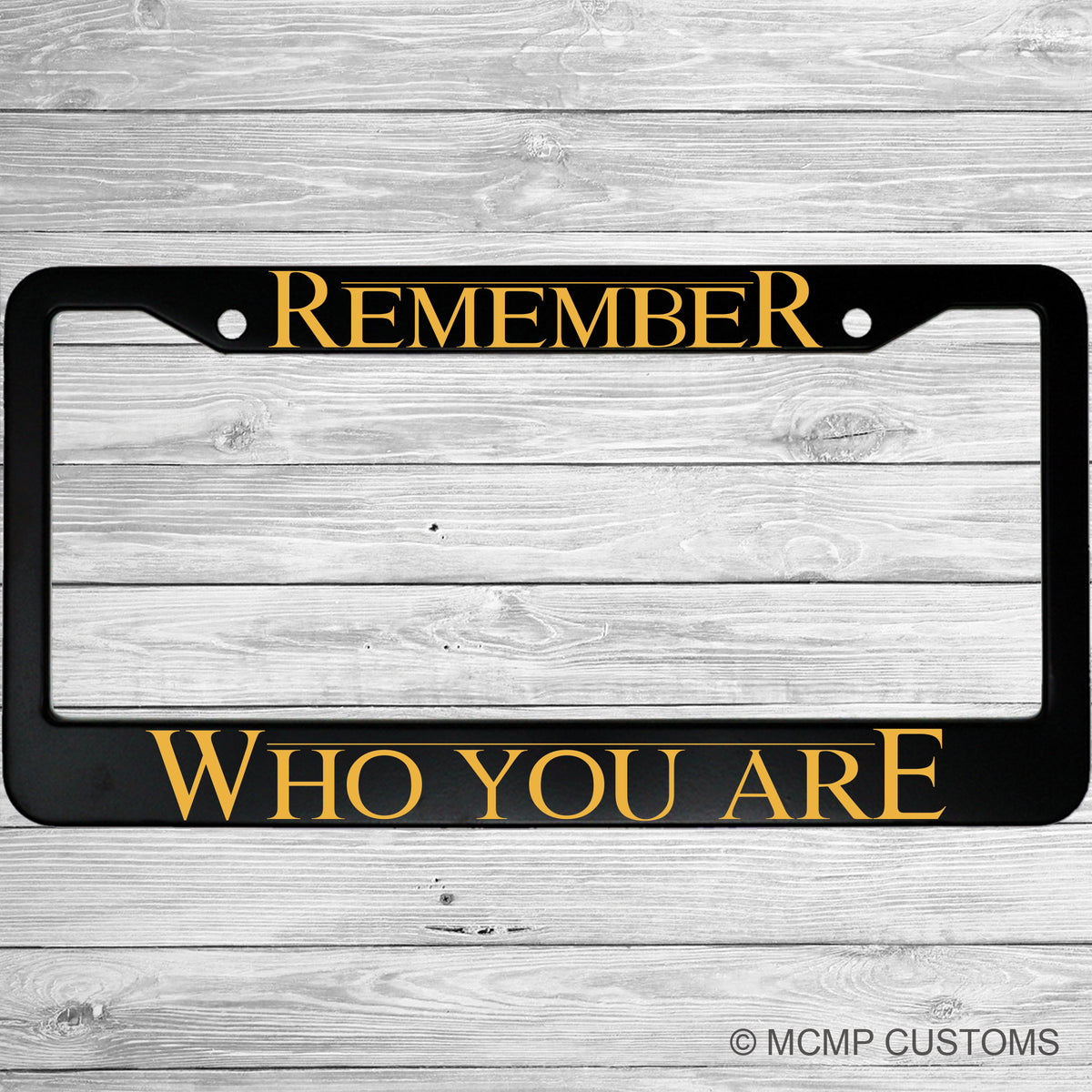 "Remember Who You Are" license plate frame shown on vehicle — lifestyle photo