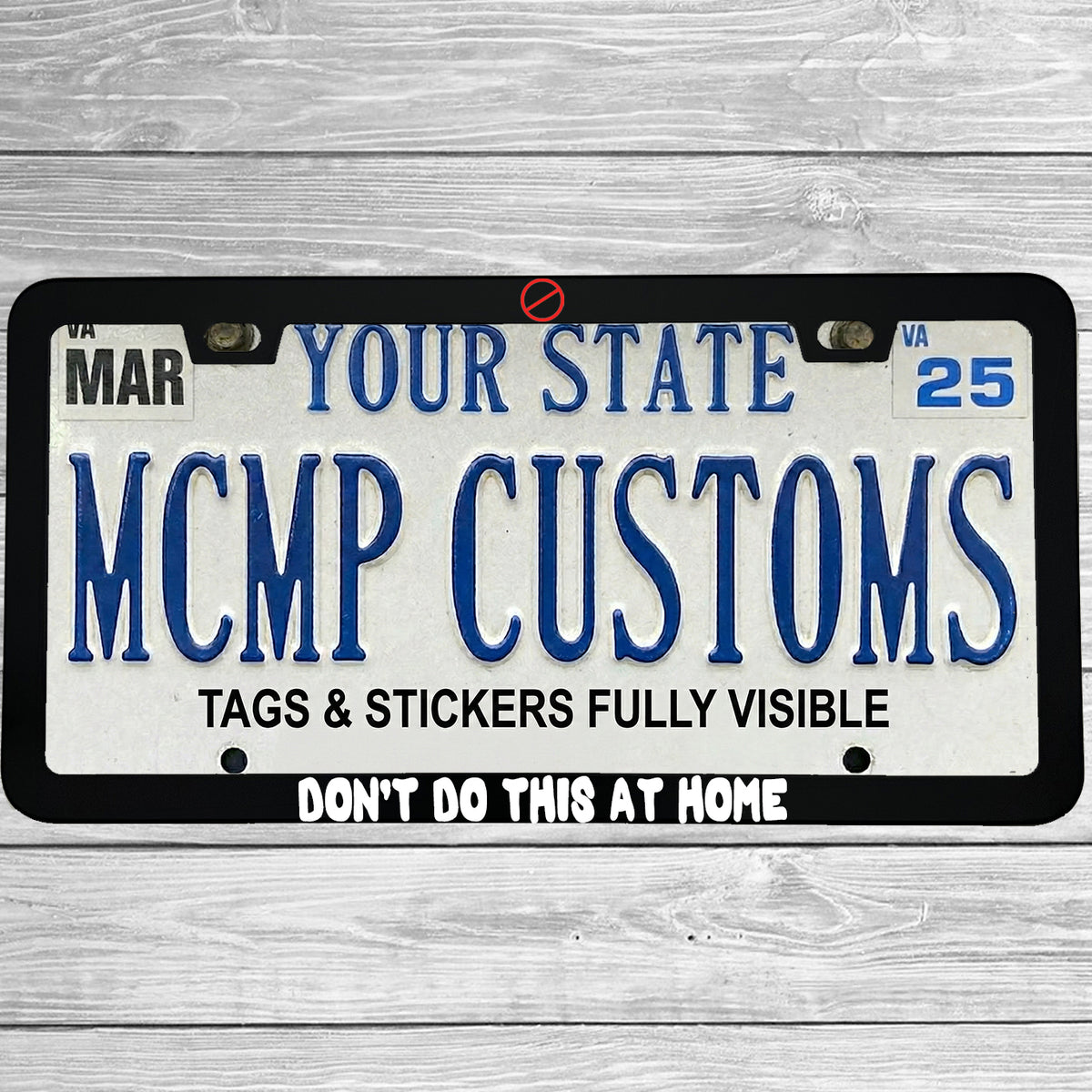 "Don't Do This At Home" license plate frame shown on vehicle — lifestyle photo