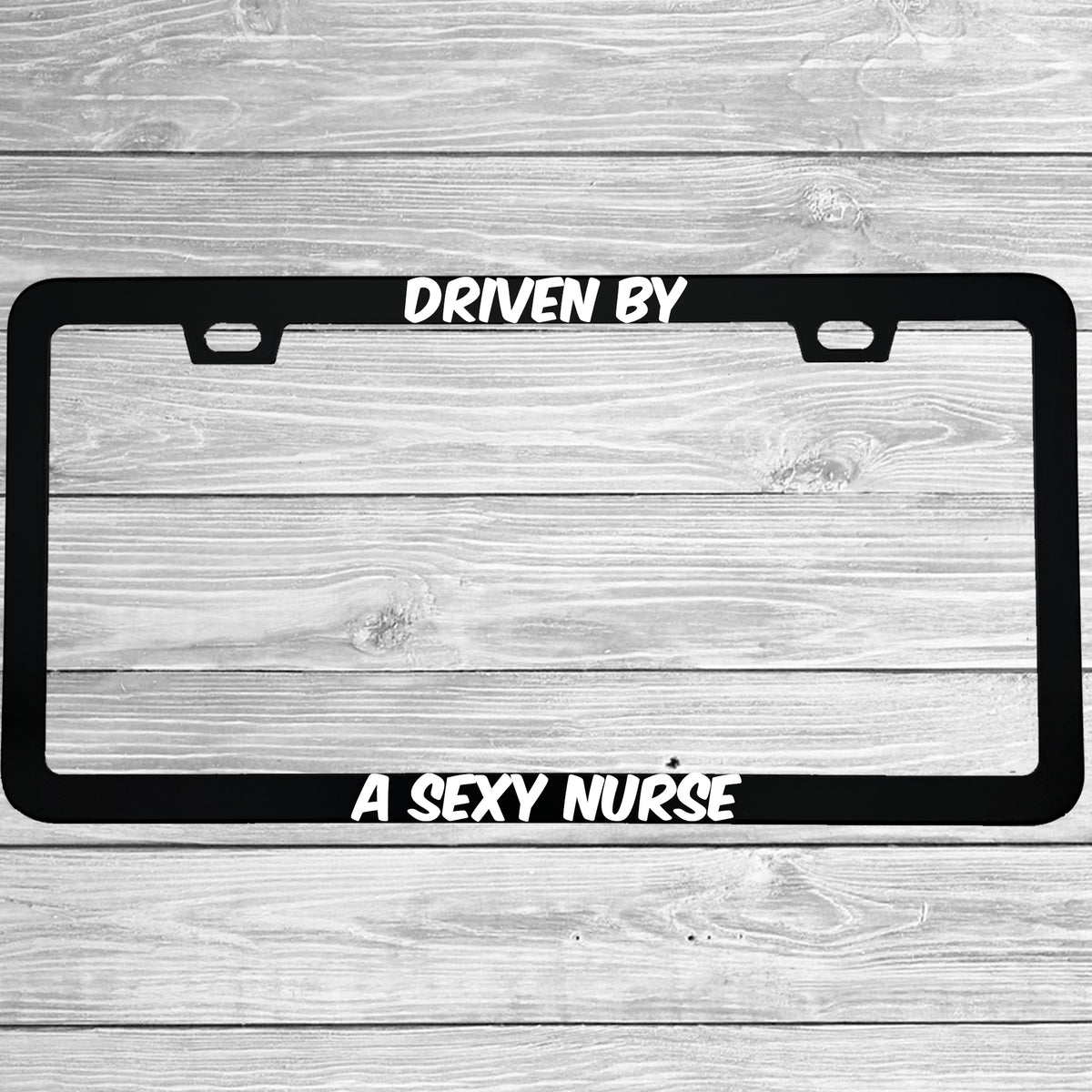 Close-up of "Driven By A Sexy Nurse" license plate frame showing fade-proof print quality