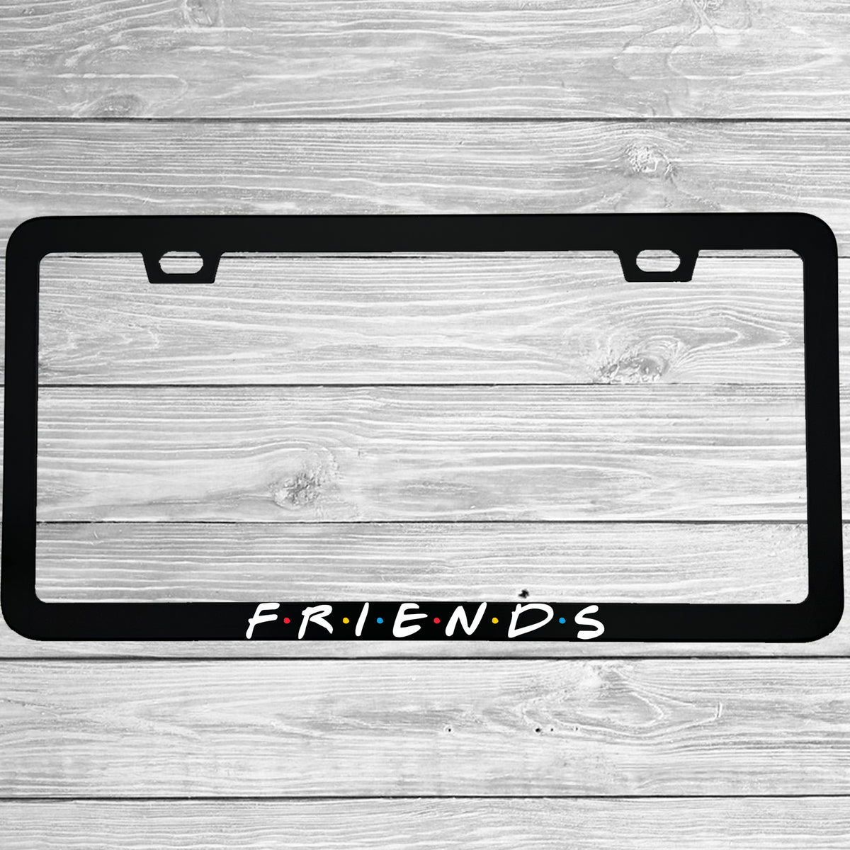 Close-up of "Friends TV Show Logo" license plate frame showing fade-proof print quality