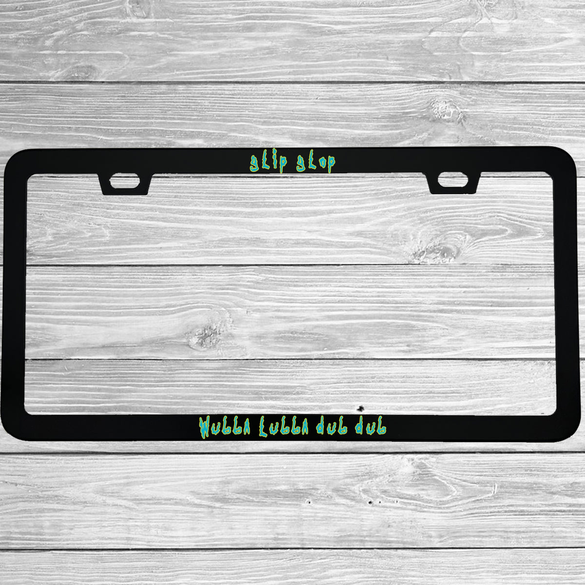 Close-up of "Glip Glop Wubba Lubba Dub Dub" license plate frame showing fade-proof print quality