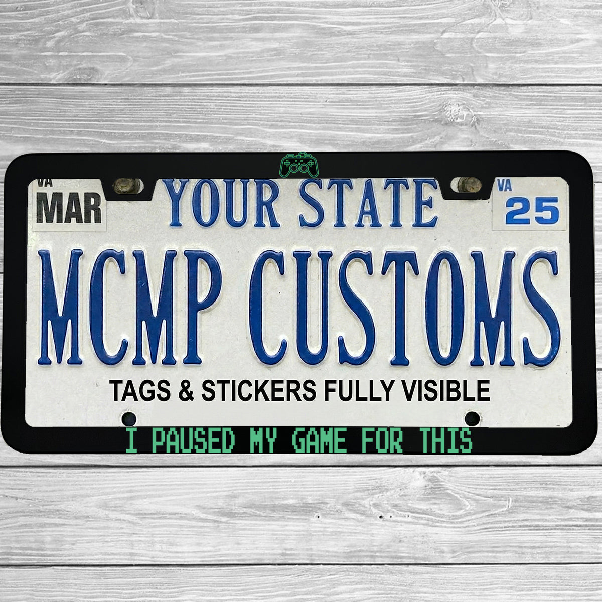 "I Paused My Game For This" license plate frame shown on vehicle — lifestyle photo