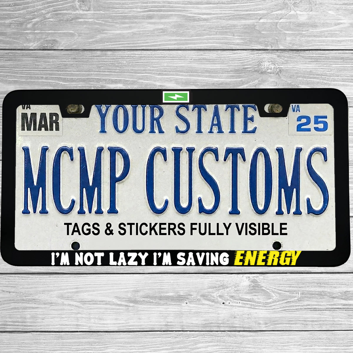"I'm Not Lazy, I'm Saving Energy" license plate frame shown on vehicle — lifestyle photo