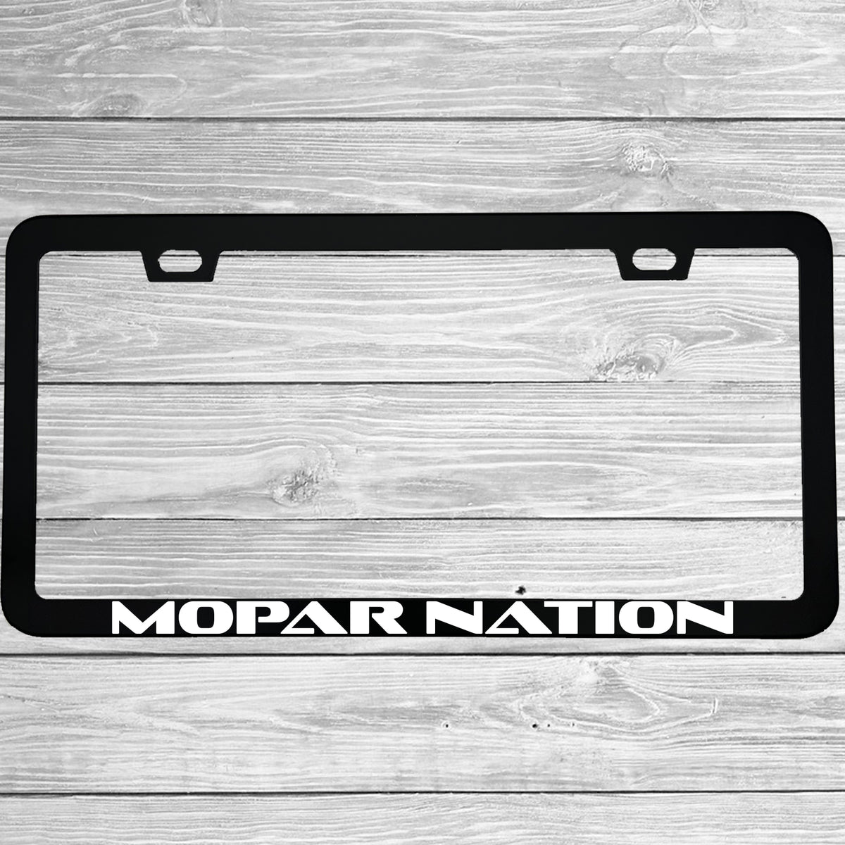 Close-up of "Mopar Nation" license plate frame showing fade-proof print quality