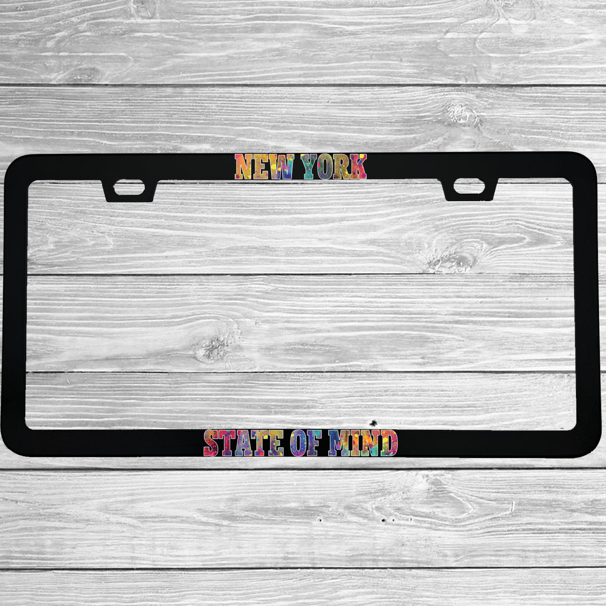 Close-up of "New York State Of Mind" license plate frame showing fade-proof print quality