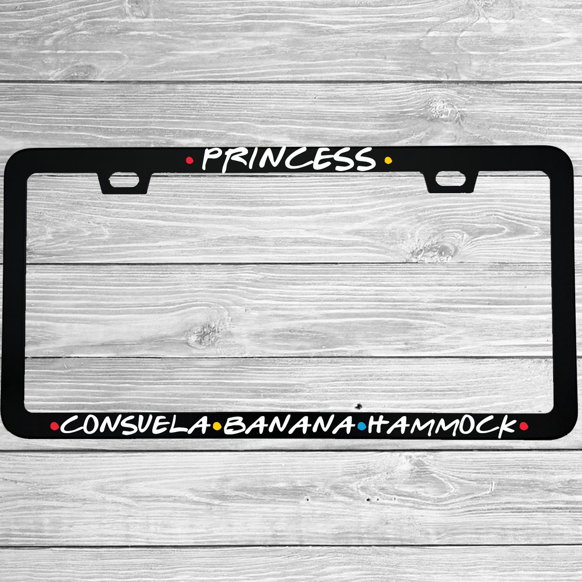 Close-up of "Princess Consuela Banana Hammock" license plate frame showing fade-proof print quality