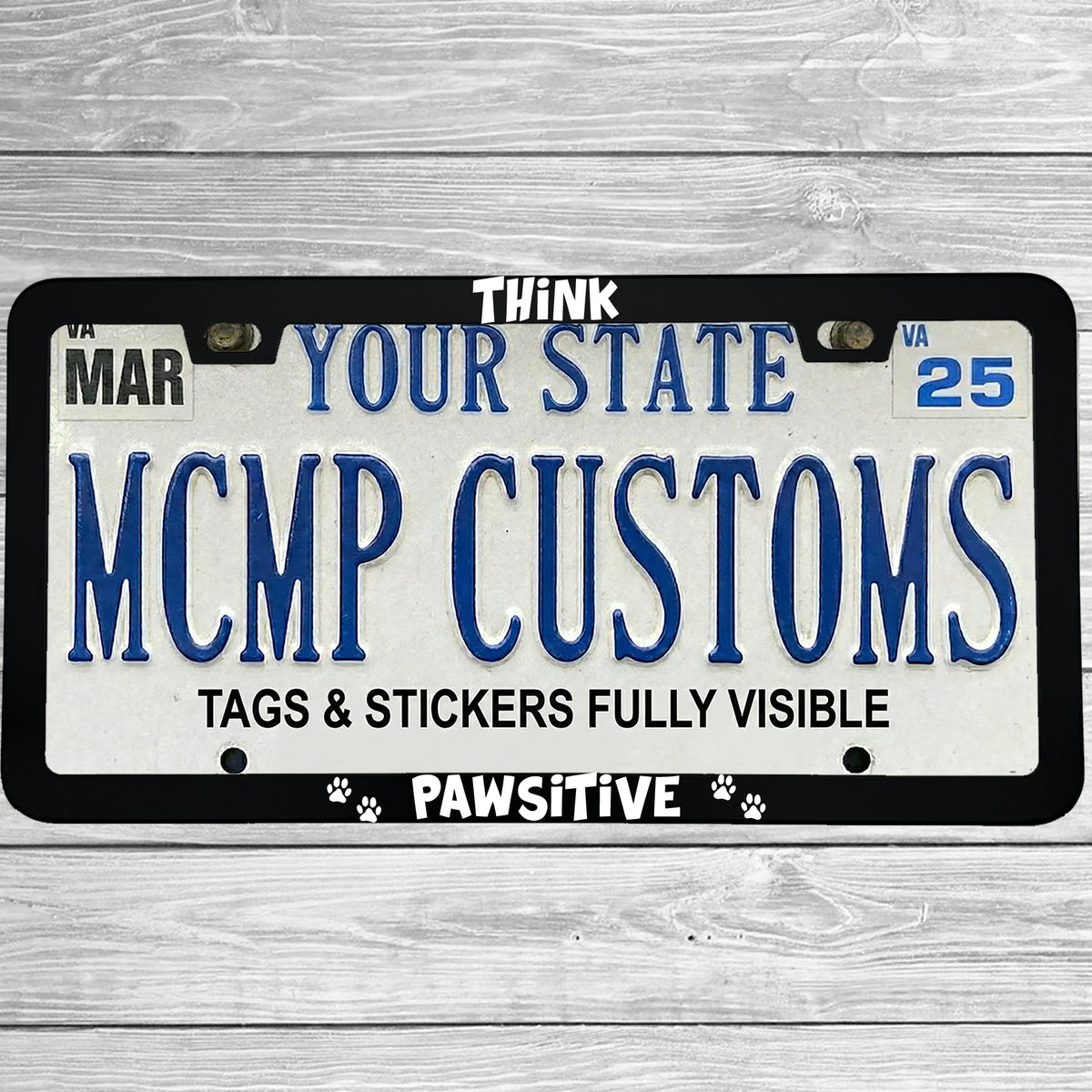 "Think Pawsitive (Positive)" license plate frame shown on vehicle — lifestyle photo