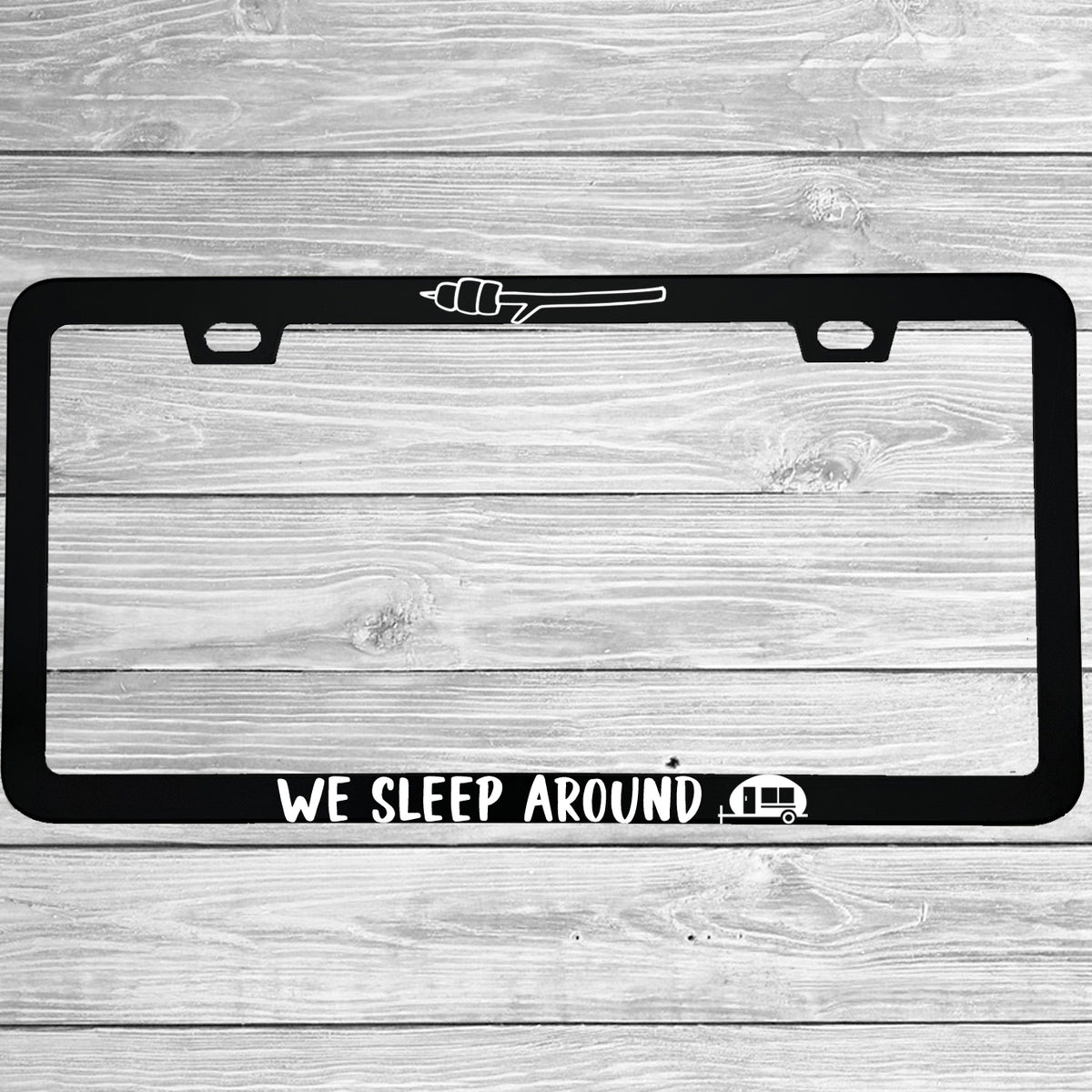 Close-up of "We Sleep Around" license plate frame showing fade-proof print quality