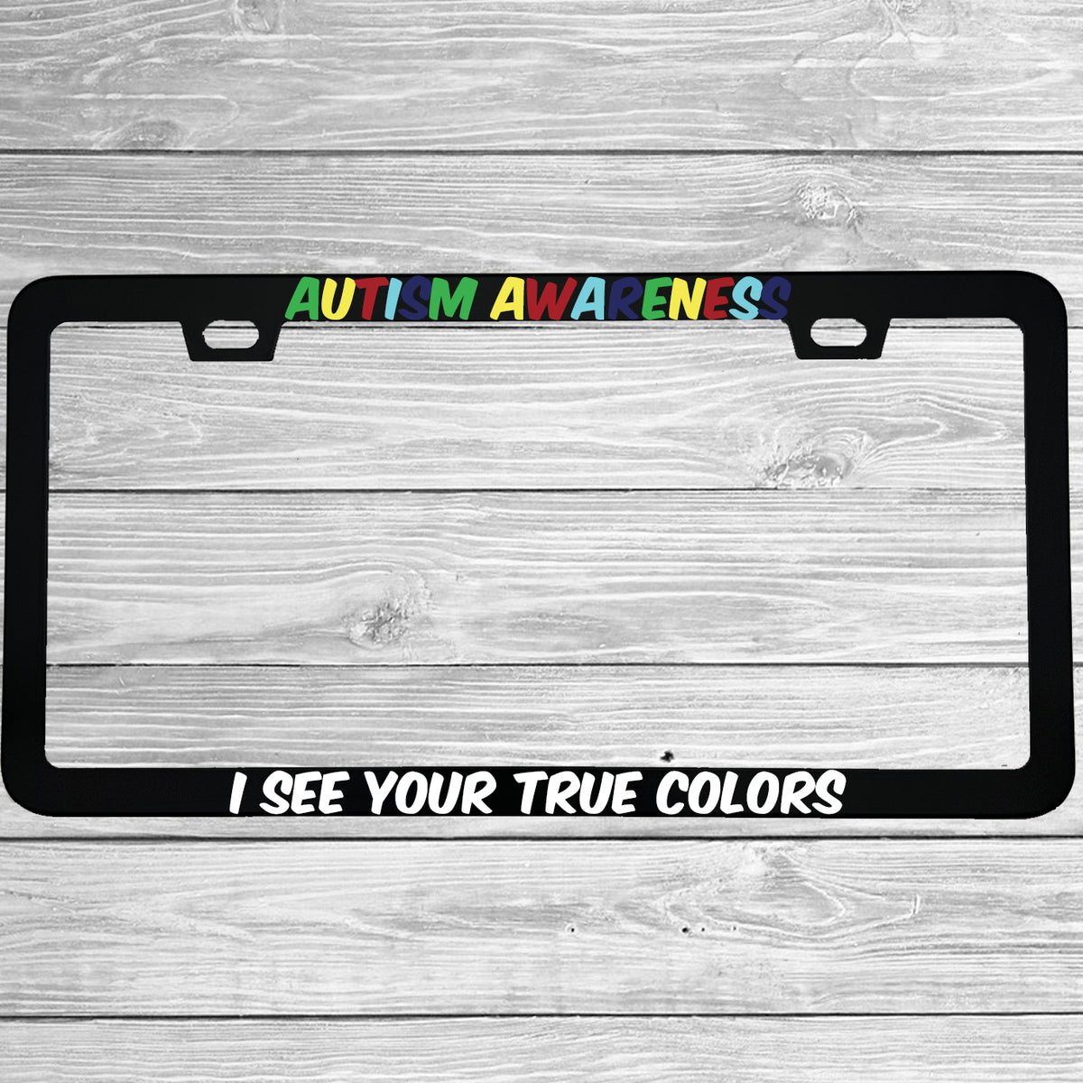 Close-up of "Autism Awareness I See Your True Colors" license plate frame showing fade-proof print quality