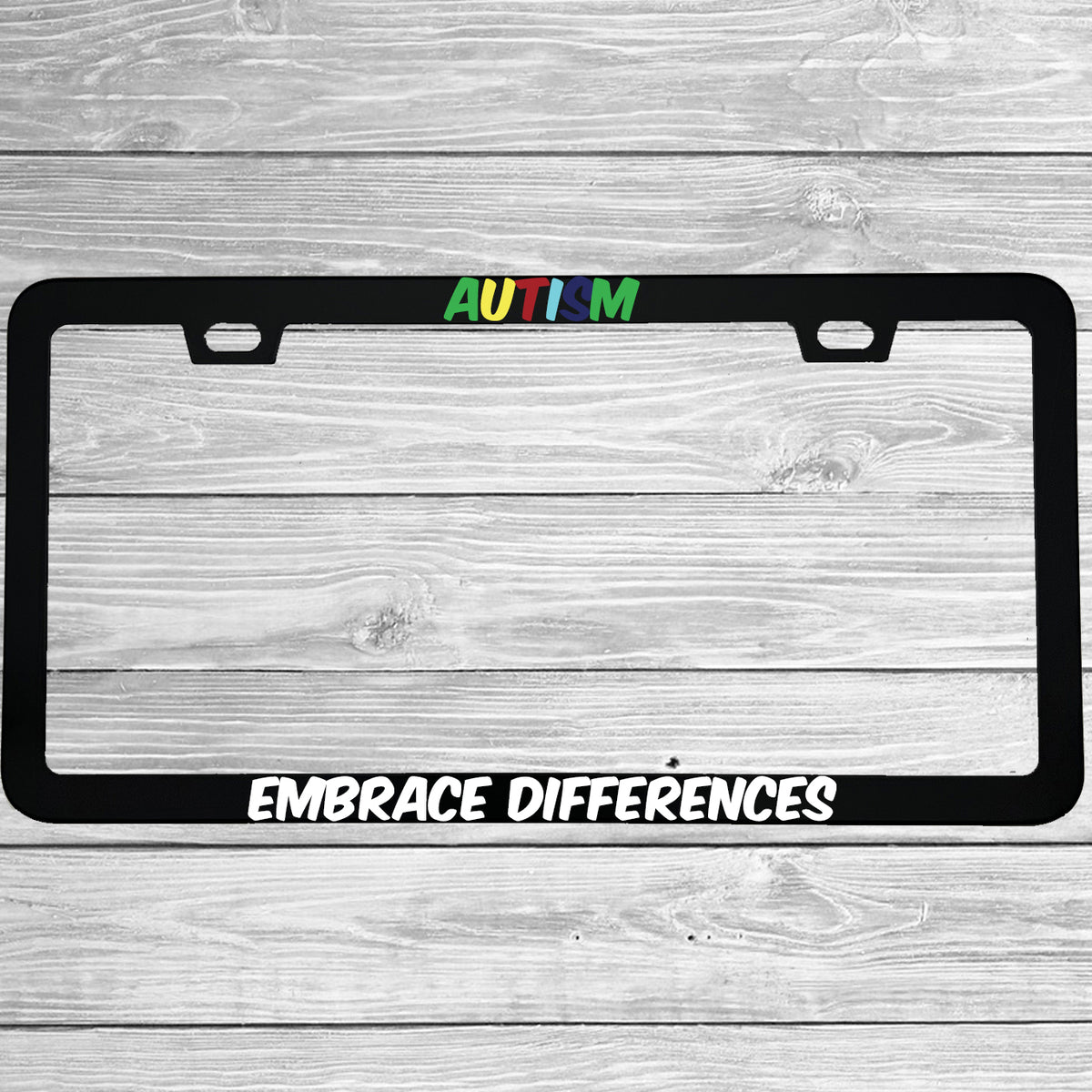 Close-up of "Autism Embrace Differences" license plate frame showing fade-proof print quality