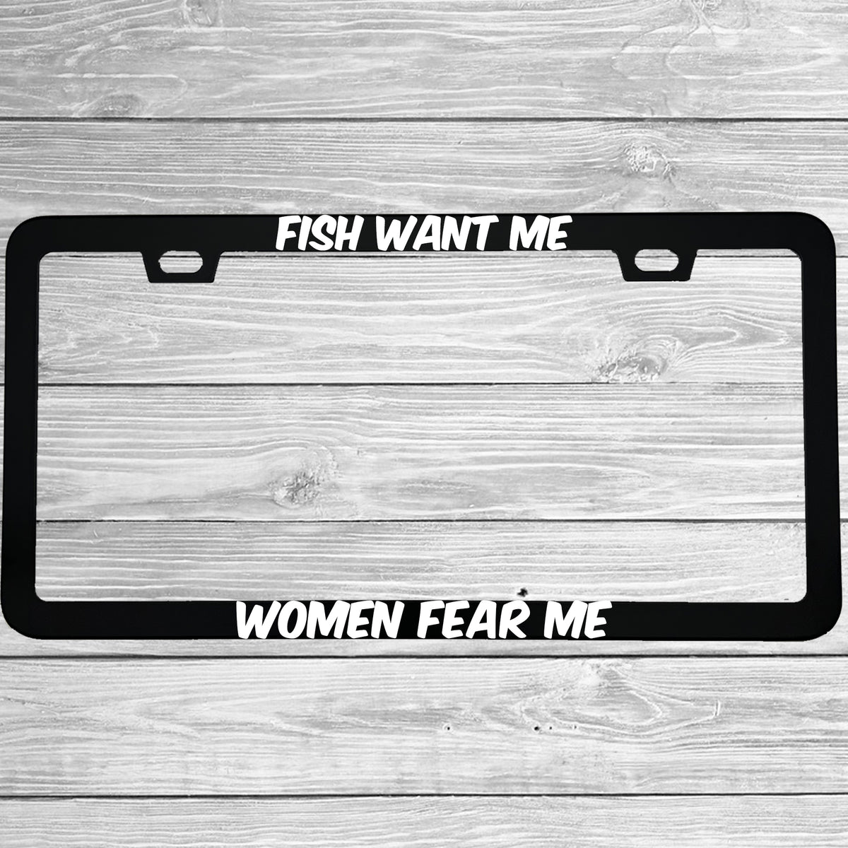 Close-up of "Fish Want Me, Women Fear Me" license plate frame showing fade-proof print quality