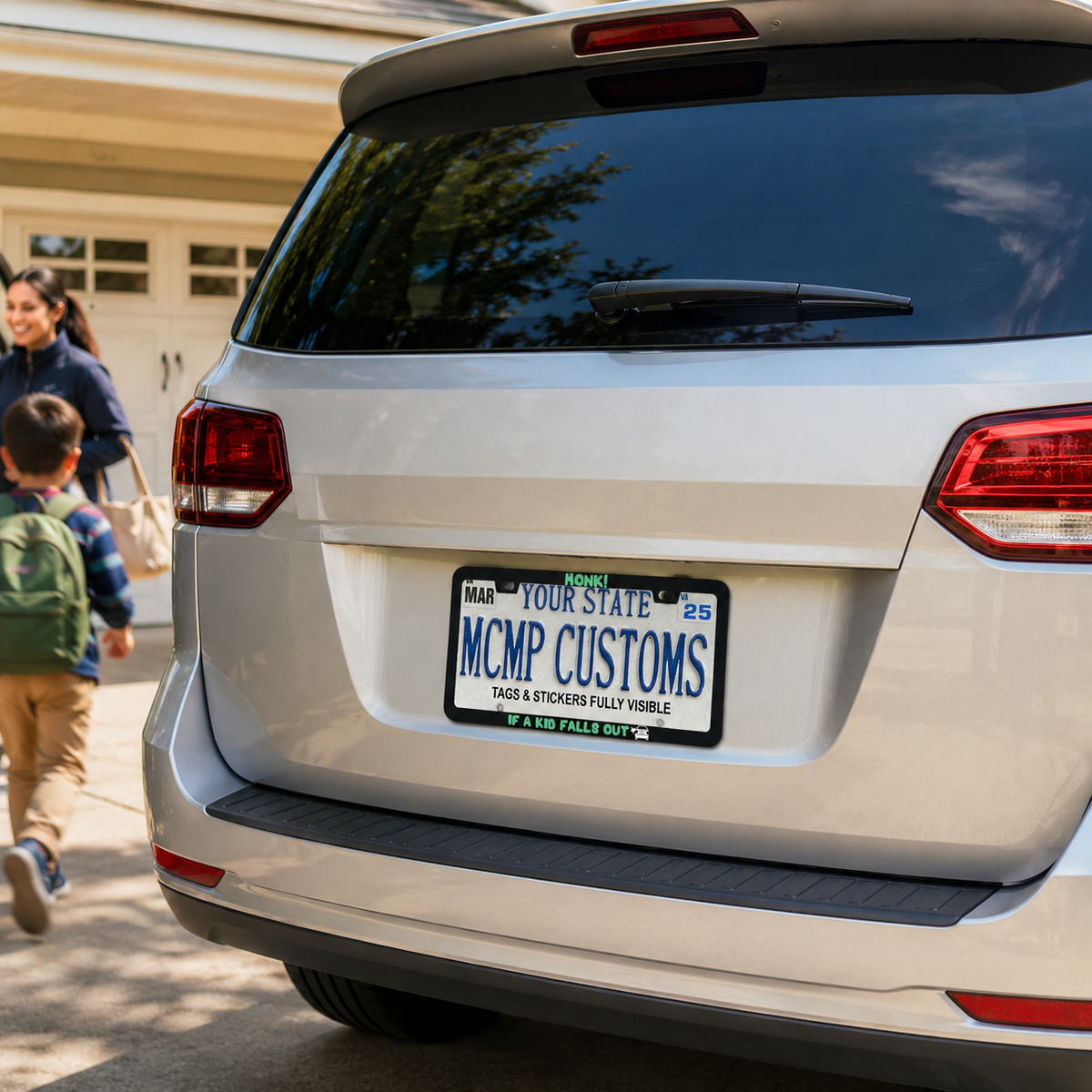 "Honk If A Kid Falls Out Parent" license plate frame shown on vehicle — lifestyle photo