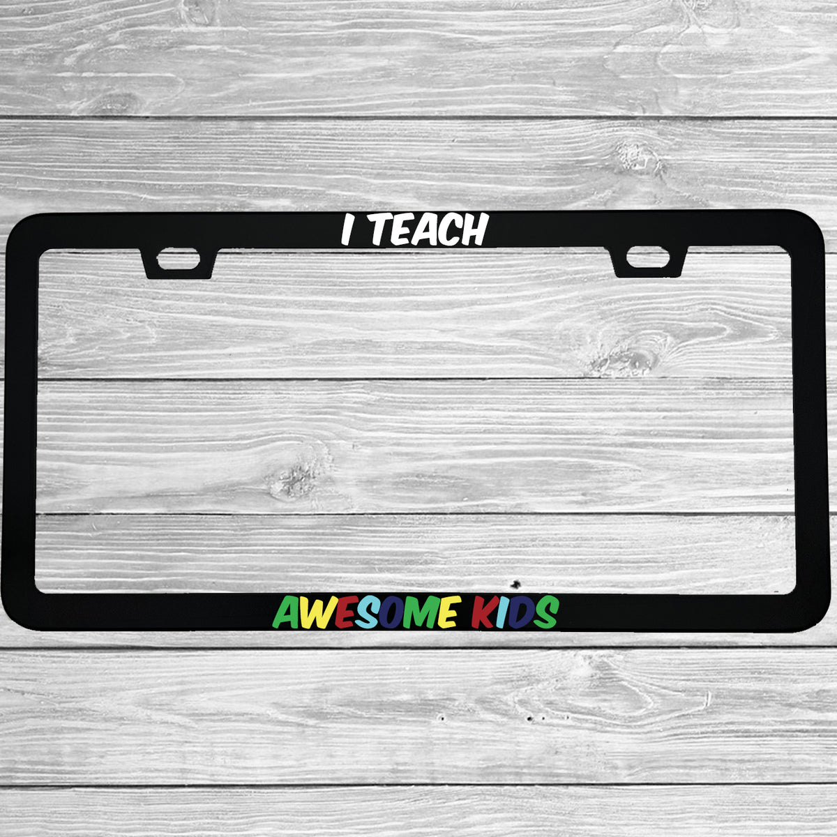 Close-up of "I Teach Awesome Kids Autism Awareness" license plate frame showing fade-proof print quality