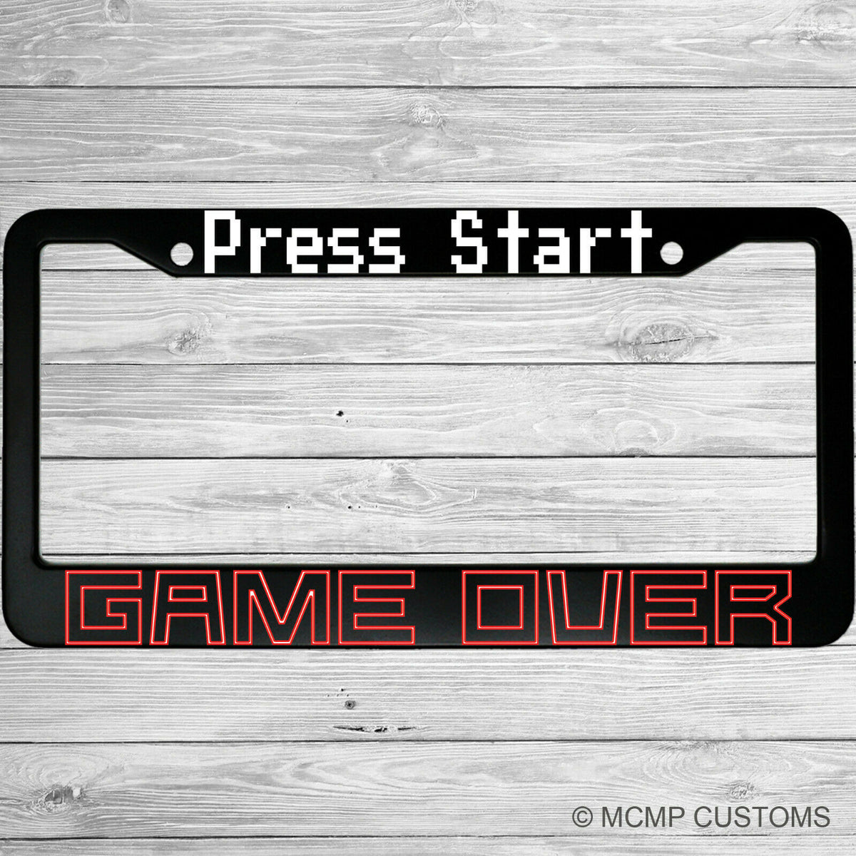 "Press Start Game Over" license plate frame shown on vehicle — lifestyle photo