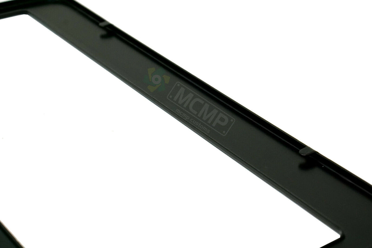 Close-up of "My Stomach Is Flat The L Is Just Silent" license plate frame showing fade-proof print quality