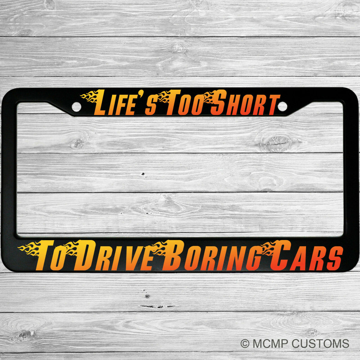 "Lifes Too Short To Drive Boring Cars" license plate frame shown on vehicle — lifestyle photo