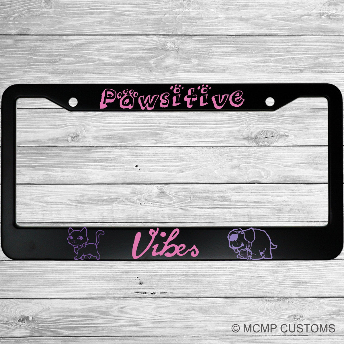 "Pawsitive Vibes (Positive Vibes)" license plate frame shown on vehicle — lifestyle photo